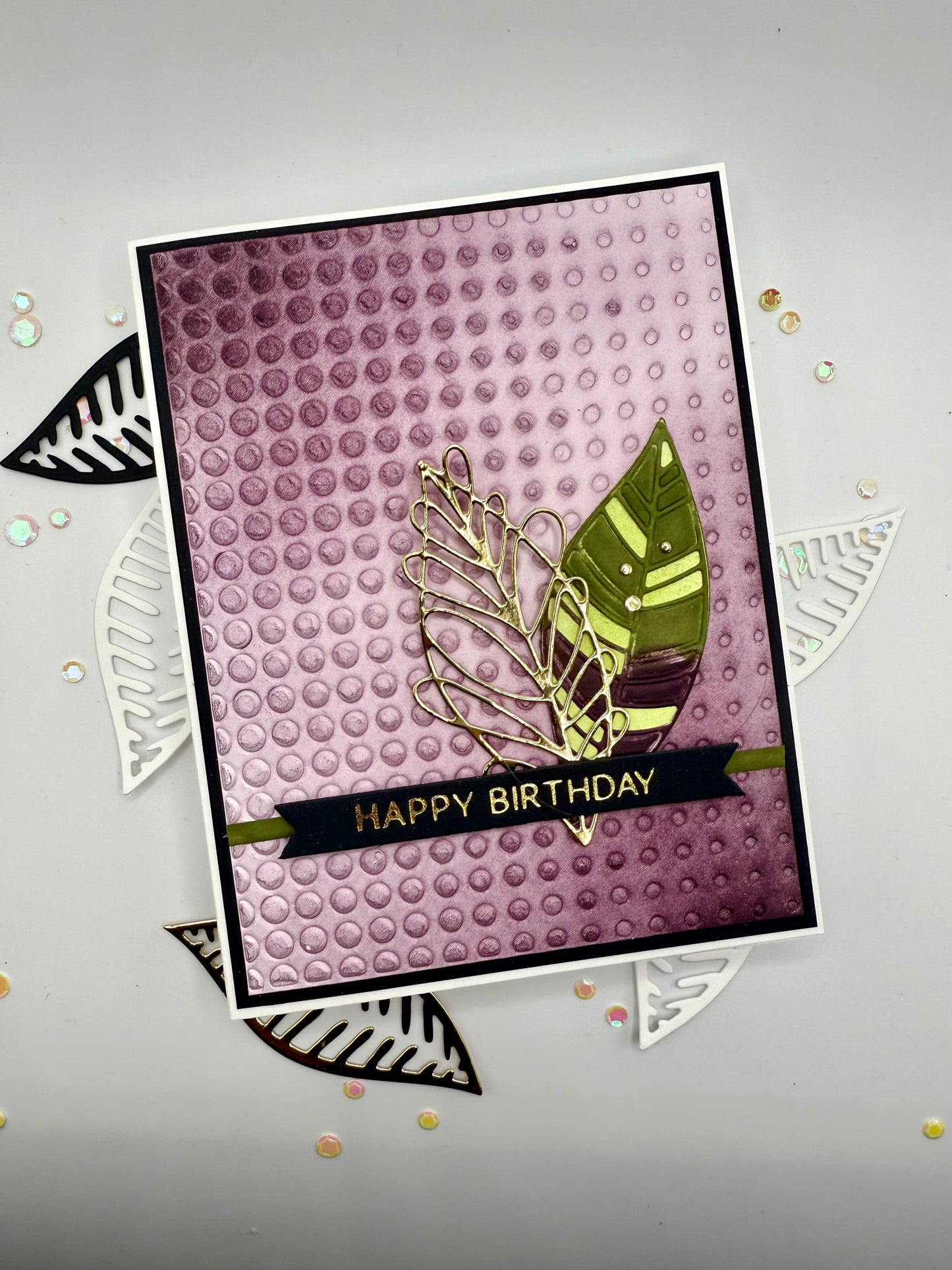 Purple textured background with leaves