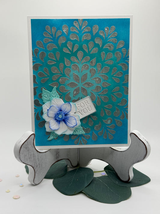 Turquoise textured background with cute rose