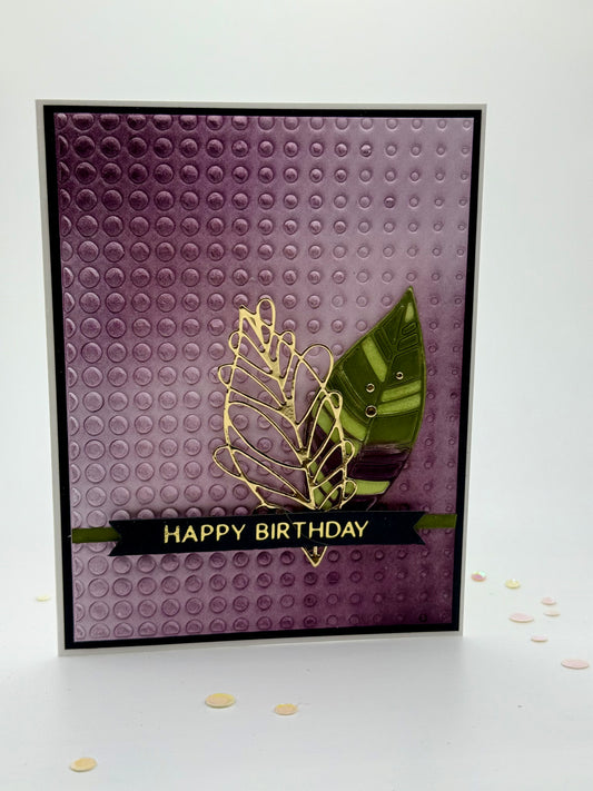 Purple textured background with leaves